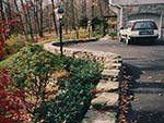 garage level with raised turn around retaining wall