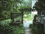 arched entrance to patio from garage walk