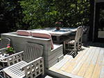 built in table and benches at kitchen door for year round use