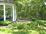 small brick patio with retaining wall at porch 