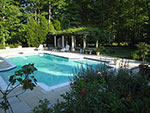 pool with double steps and pergola