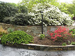 drive entrance with new stone retaining wall