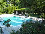 view from terrace to pool and pergola