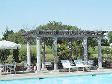 Pool side pergola with clay columns