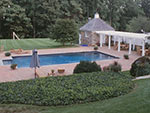 wood pergola with storage building